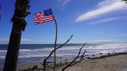 american flag on the beach