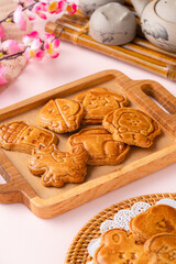 Mooncake biscuits are little sweet snacks which are like the outer layer of the mooncake. Unlike the traditional baked mooncakes, these biscuits are usually made without filling and are much thicker.