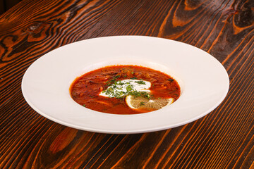 Russian traditional Solyanka soup with sausages