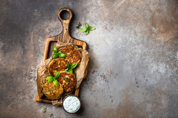zucchini and parmesan fritter with tzatziki sauce