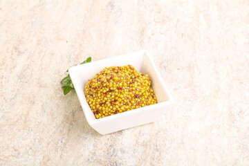 Grain mustard sauce in the bowl