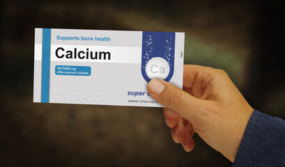 Calcium tablets box pack in hand 3d illustration