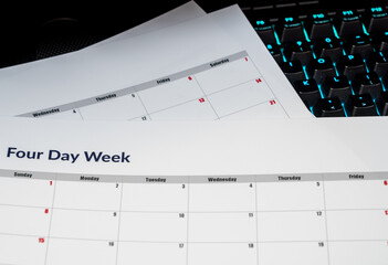 Printed calendar for a 4 day working week showing weekend days in red in new approach to productivity