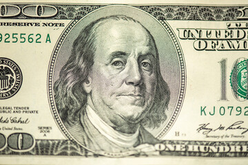 Part of 100 dollars banknote isolated on white background