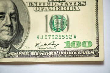 Part of 100 dollars banknote isolated on white background