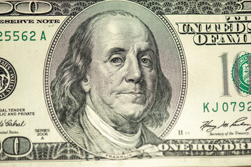 Part of 100 dollars banknote isolated on white background