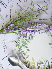 tablecloth with lavender print and serving plate with napkin