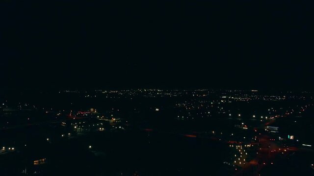 Top view of the night city where fireworks are exploding.Fireworks are blown up on the holiday. High quality 4k footage