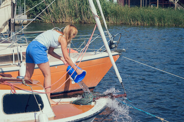 Cheerful young woman on a yacht