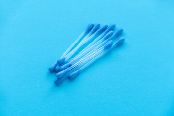 A cotton buds on blue background.