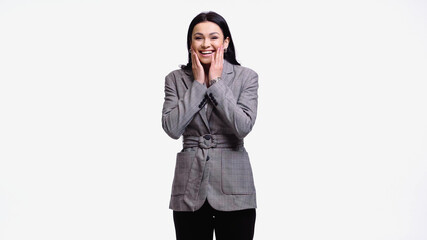 Positive businesswoman with hands near cheeks looking at camera isolated on white.