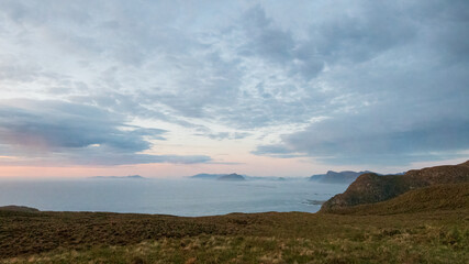 Sunset on mountain over the ocean with negative space