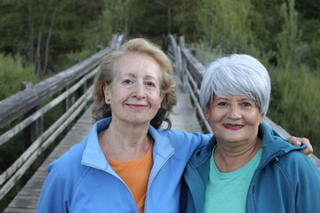 Obraz premium Two senior female friends in nature