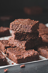 Pieces of chocolate brownie, food photo.