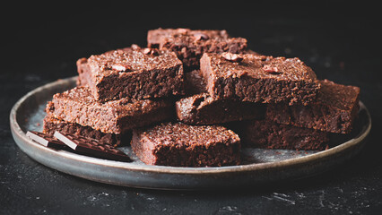 Pieces of chocolate brownie, food photo.