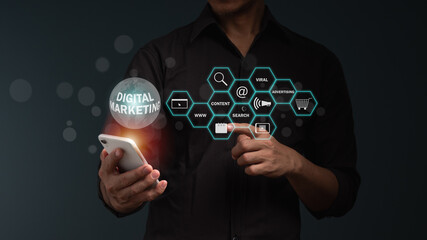 Digital marketing media in virtual screen. businessman uses finger point to the icon on mobile phone and modern compute with VR icon diagram.