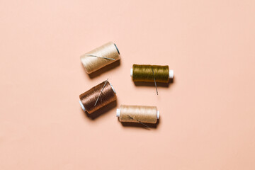 Sewing items flat lays from above. Collection of threads for sewing on bright background