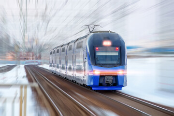 Naklejka premium Modern high speed train in motion blur. Passenger Transportation.