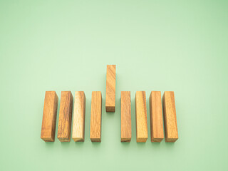 Top view of empty wooden blocks isolated on a green background. Concept of planning, strategy, and risk and in business. Space for text