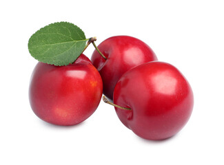 Delicious ripe cherry plums with leaf on white background