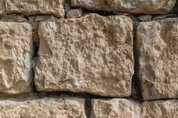 Stone wall texture background - grey stone siding with different sized stones