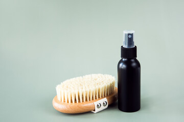 
Anti-cellulite body massage wooden brush, eco-friendly bamboo fiber scrub and cosmetic bottle. Body care at home.