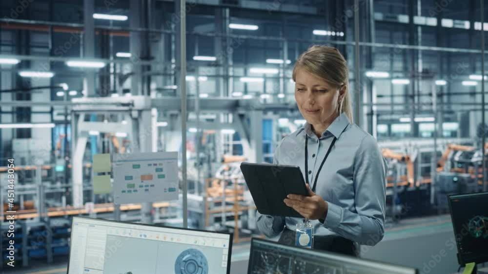 Poster car factory office concept: portrait of successful female chief automotive engineer using tablet com