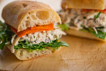 Chicken sandwiches. Served on toasted whole grain bread with melted Swiss cheese, mayonnaise and seasoned salt and pepper.  Classic American restaurant or diner lunch or brunch sandwich favorite.