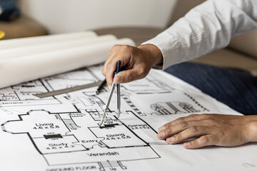 Architects use compasses to write on the blueprints of the houses, designing the buildings according to the standards and the law, designing the houses according to the needs of the residents.