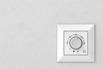 Air conditioner control panel (thermostat) on a gray wall