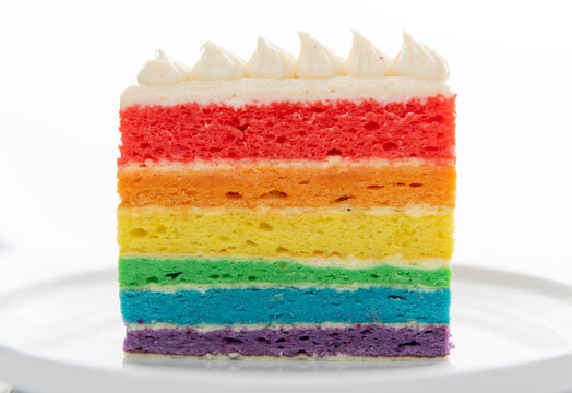 Slice of Rainbow Cake on White Background