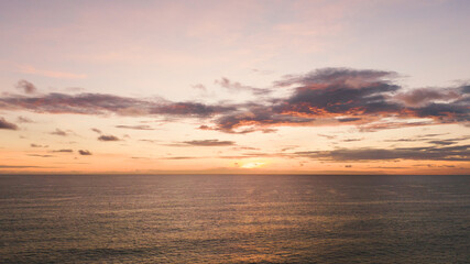 Naklejka na ściany i meble Beautiful sunset over the sea.Amazing Sunlight reflection over sea slow motion video 4K.