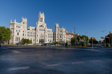 Fototapeta na wymiar Cibeles Palace is a building with white facades and is located in one of the historical centres of Madrid. Now used as the city hall and the public cultural centre