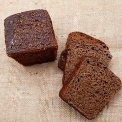 Photo of baked black bread. A loaf of bread. Private bakery.