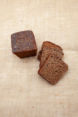 Photo of baked black bread. A loaf of bread. Private bakery.