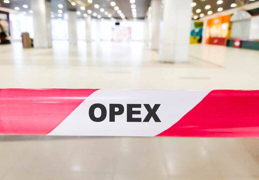 OPEX business text on red ribbon with restrictions.