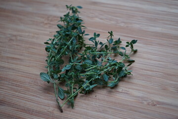 Lemon thyme on wooden board