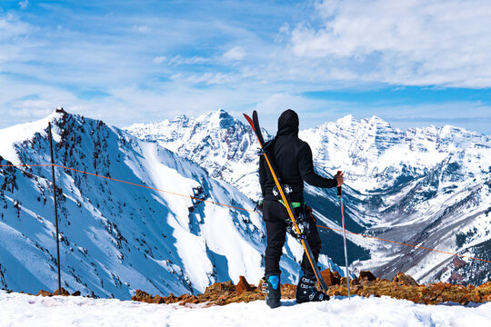 Man With Skis At Summit Extreme Ski Concept