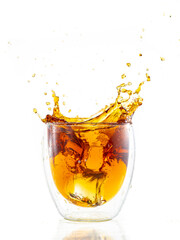 splash from falling ice in a glass with double walls