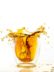 splash from falling ice in a glass with double walls