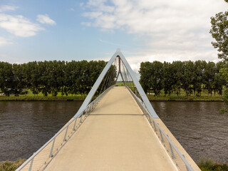 Pedestrian and cyclist bridge over the Amsterdams Rijn Canal,  waterway in Nigtevecht The Netherlands. Liniebrug