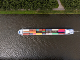 Container cargo ship at Amsterdams Rijn Canal in the Netherlands, topdown birdsseye view