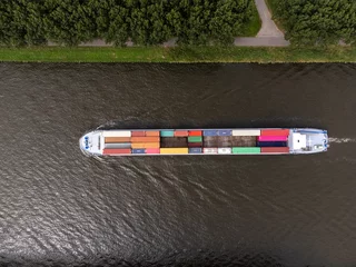 Foto op Plexiglas Container cargo ship at Amsterdams Rijn Canal in the Netherlands, topdown birdsseye view © MyStockVideo