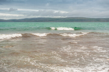 Sea waves in storm and dramatic clouds