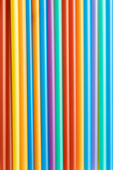 Close up of colorful plastic straws. Background