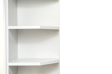 Wooden white shelf for books. Minimalism in the room. Home design.