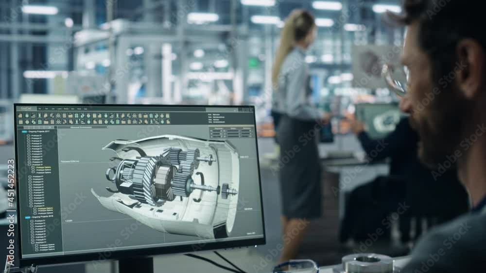 Fototapete Car Factory Office: Engineer Working on Turbine Prototype on Computer, Design Advanced 3D Model for High-Tech Green Energy Electric Engine. Diverse Team Work in Automated Manufacturing Facility