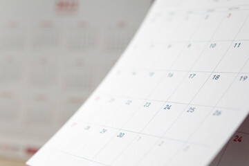 Abstract blur calendar page flipping sheet close up background business schedule planning...