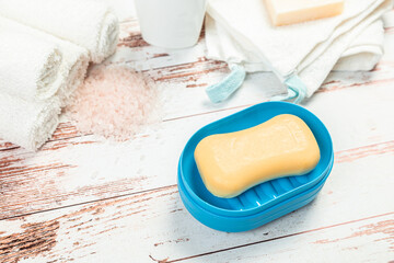 soap on a blue soap dish isolated on a white background. hygiene concept