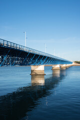 Beautiful old blue bridge over Arade river at Portimao. Sunset, no people, Portugal. Europe